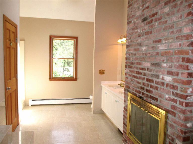 350 Training Field Road Chatham, MA 02633 - Photo 22 of 33 a bathroom with a granite countertop sink a toilet and shower