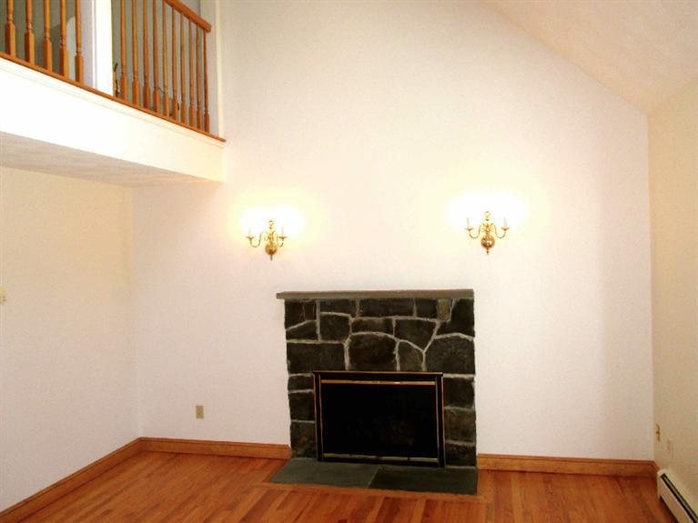 350 Training Field Road Chatham, MA 02633 - Photo 7 of 33 a view of an empty room with wooden floor and a window
