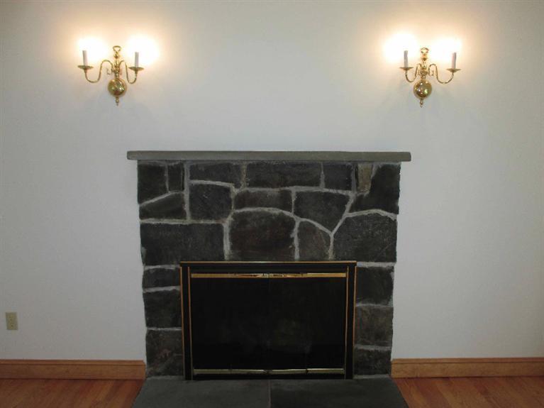 350 Training Field Road Chatham, MA 02633 - Photo 9 of 33 a room with a lamp and a fireplace