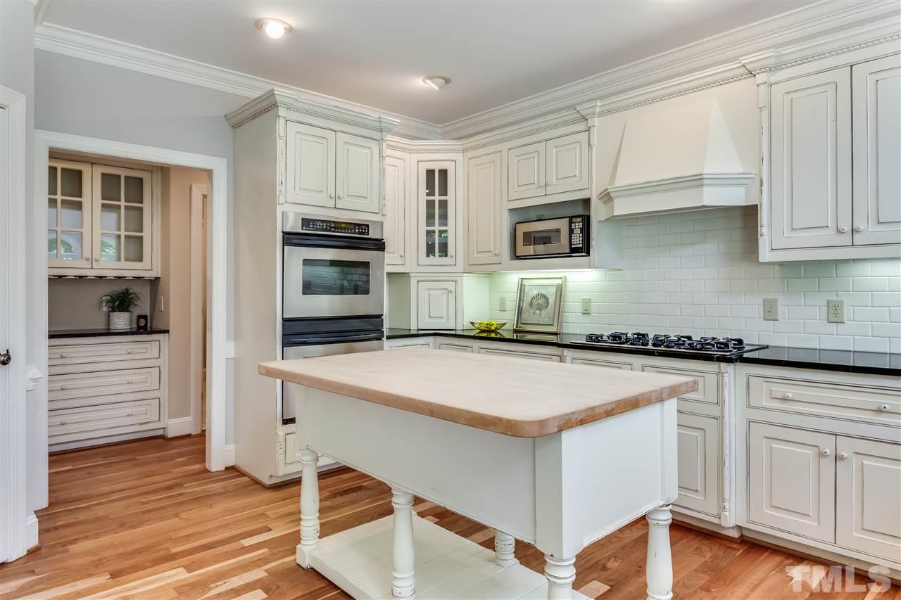5320 Deergrass Court Raleigh, NC 27613 - Photo 8 of 25 Beautiful kitchen with stainless appliances and granite counters.