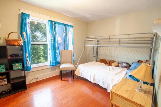 a bedroom with furniture and a window