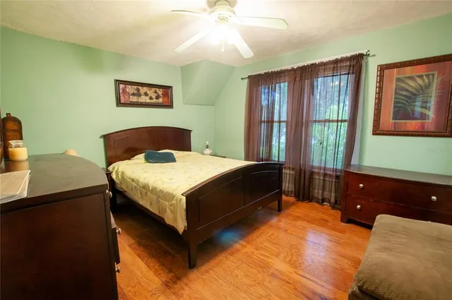 a bedroom with a bed and a dresser