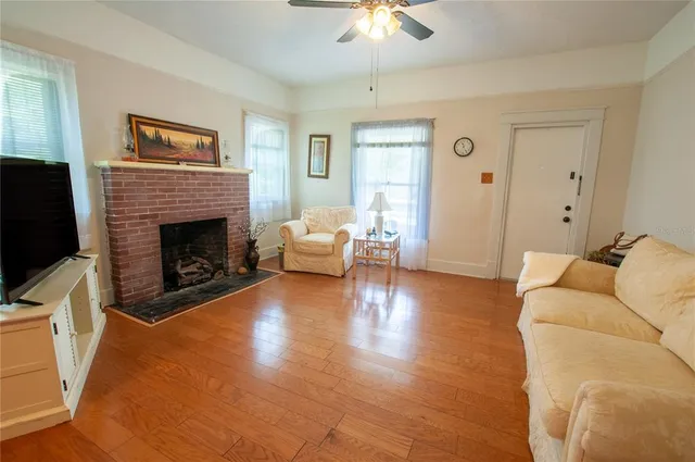 a living room with furniture and a fireplace