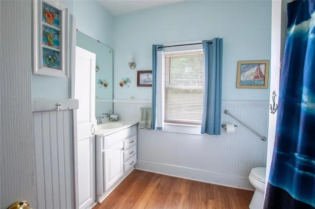 a bathroom with a sink and a window
