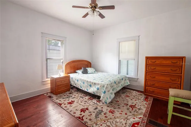 a bedroom with a bed and a dresser