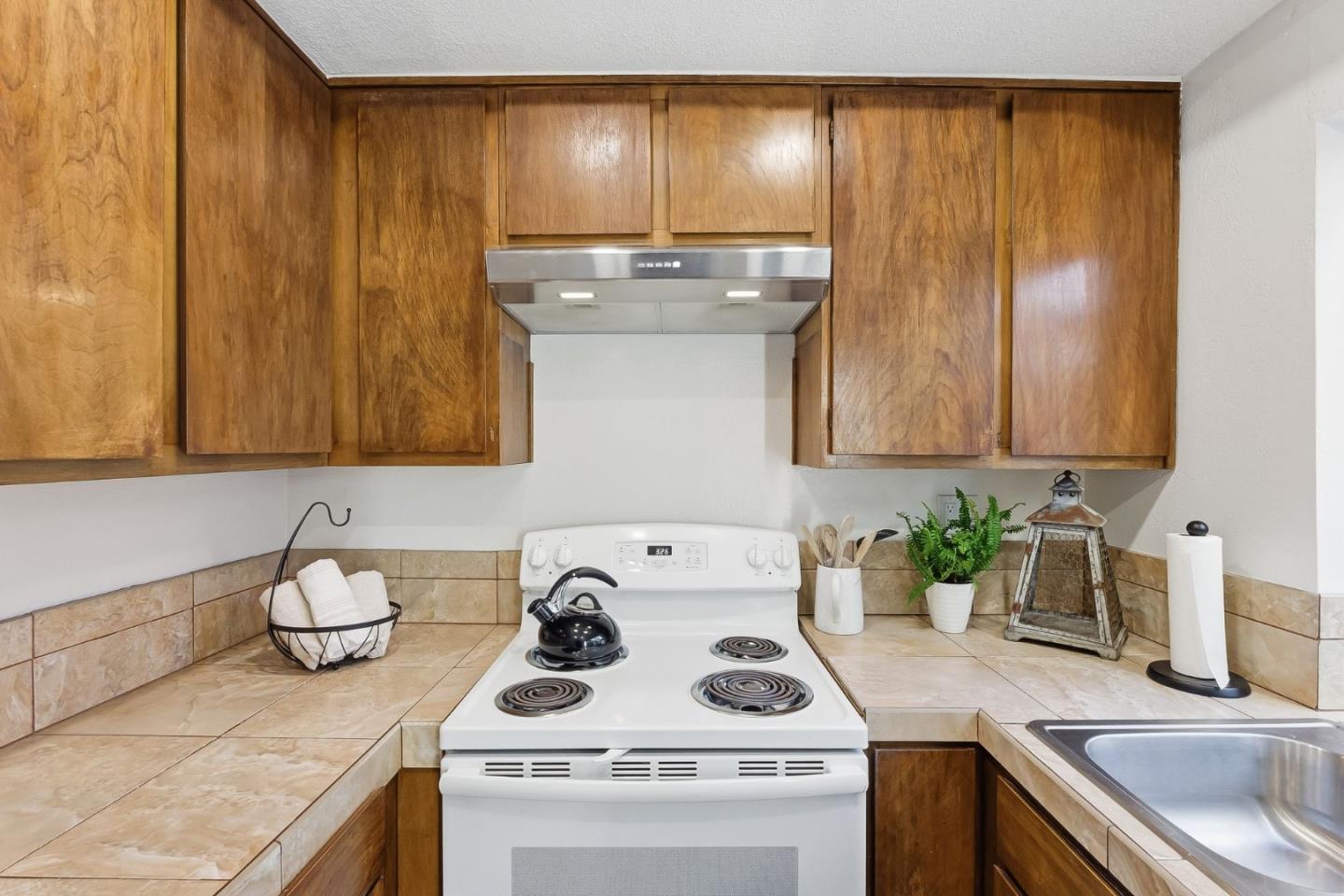 7147 Rouse Court San Jose, CA 95139 - Photo 13 of 36 a kitchen with a sink and cabinets