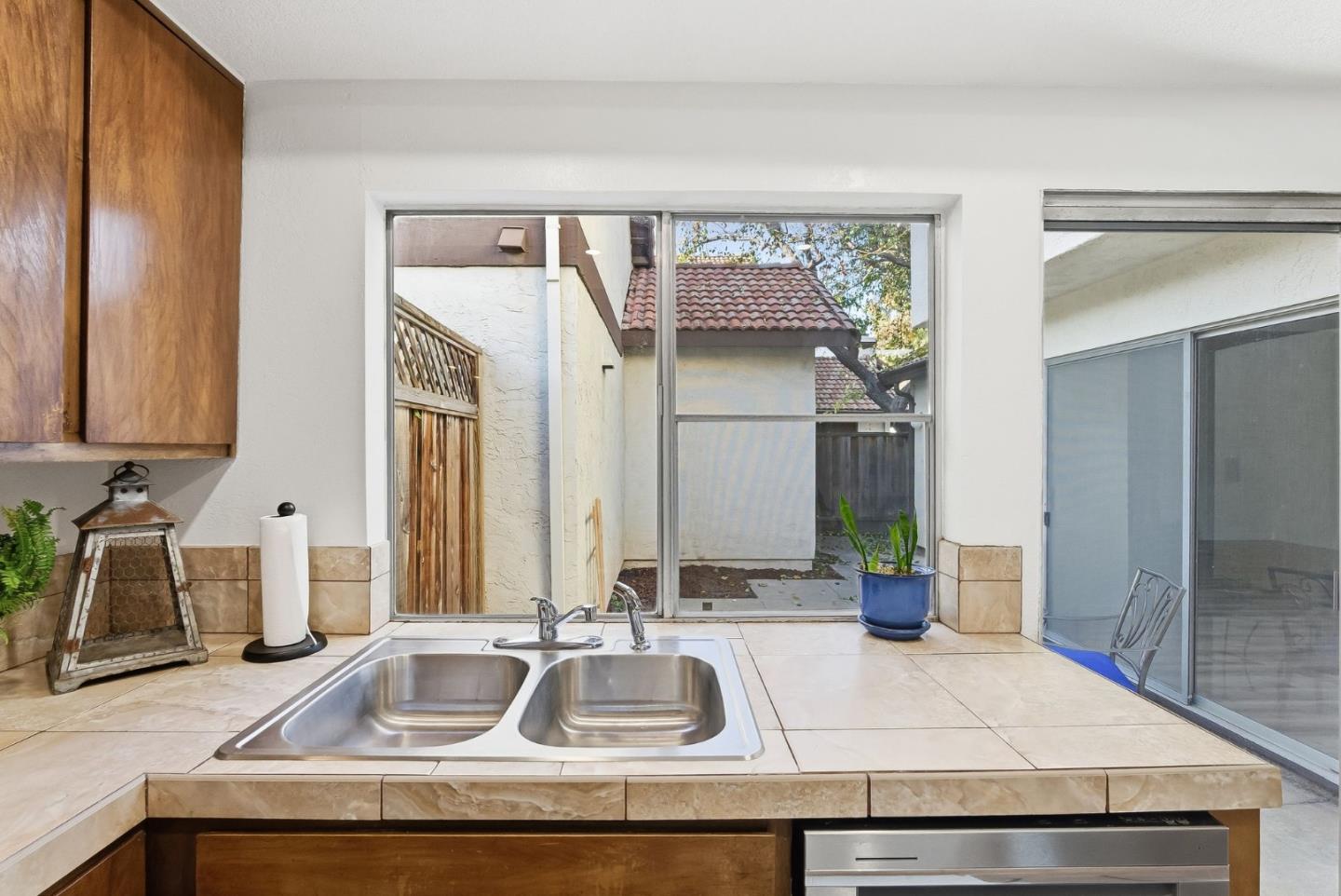 7147 Rouse Court San Jose, CA 95139 - Photo 14 of 36 a bathroom with a sink and a mirror