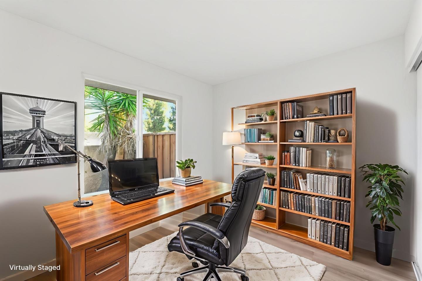 7147 Rouse Court San Jose, CA 95139 - Photo 17 of 36 a view of a workspace with furniture and a bookshelf