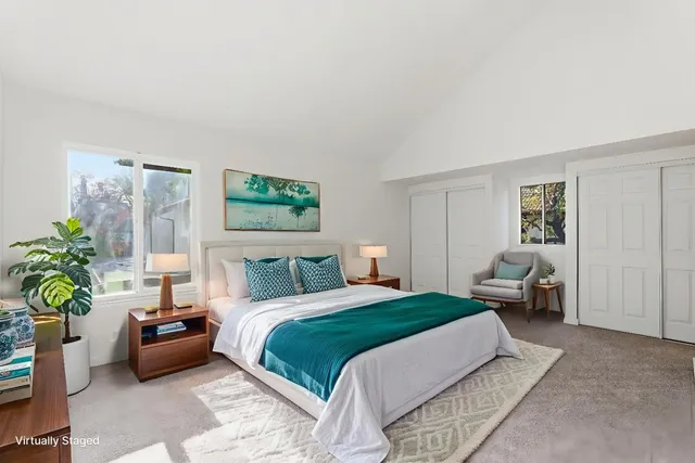 a bedroom with a bed and a couch