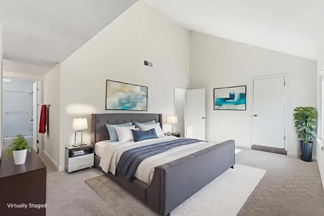 a living room with furniture and flowers