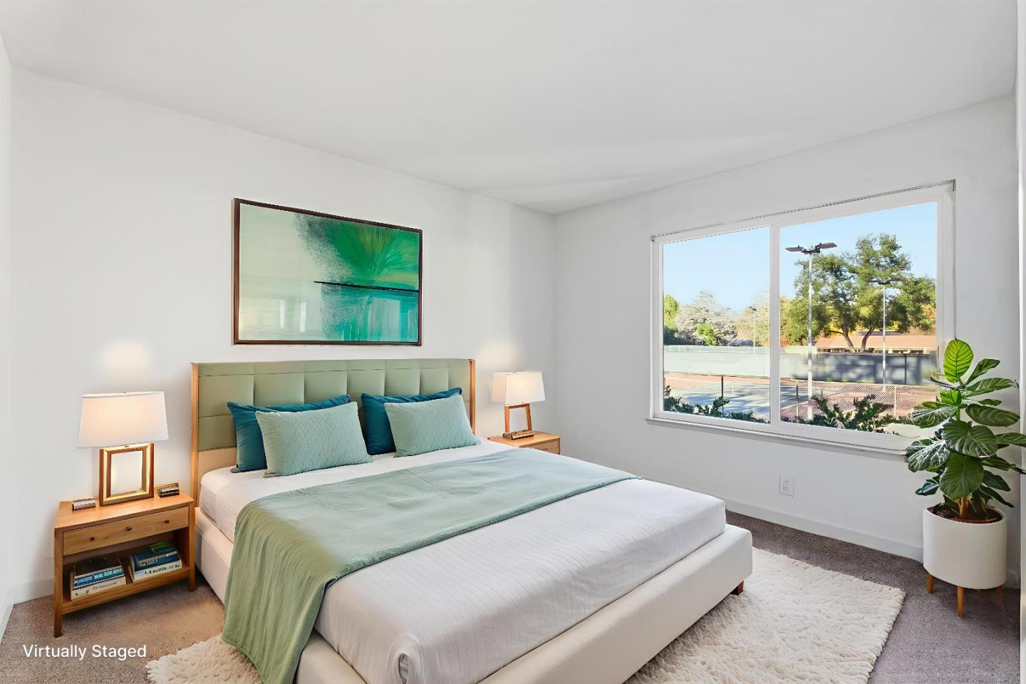 7147 Rouse Court San Jose, CA 95139 - Photo 26 of 36 a bedroom with a large bed and a potted plant