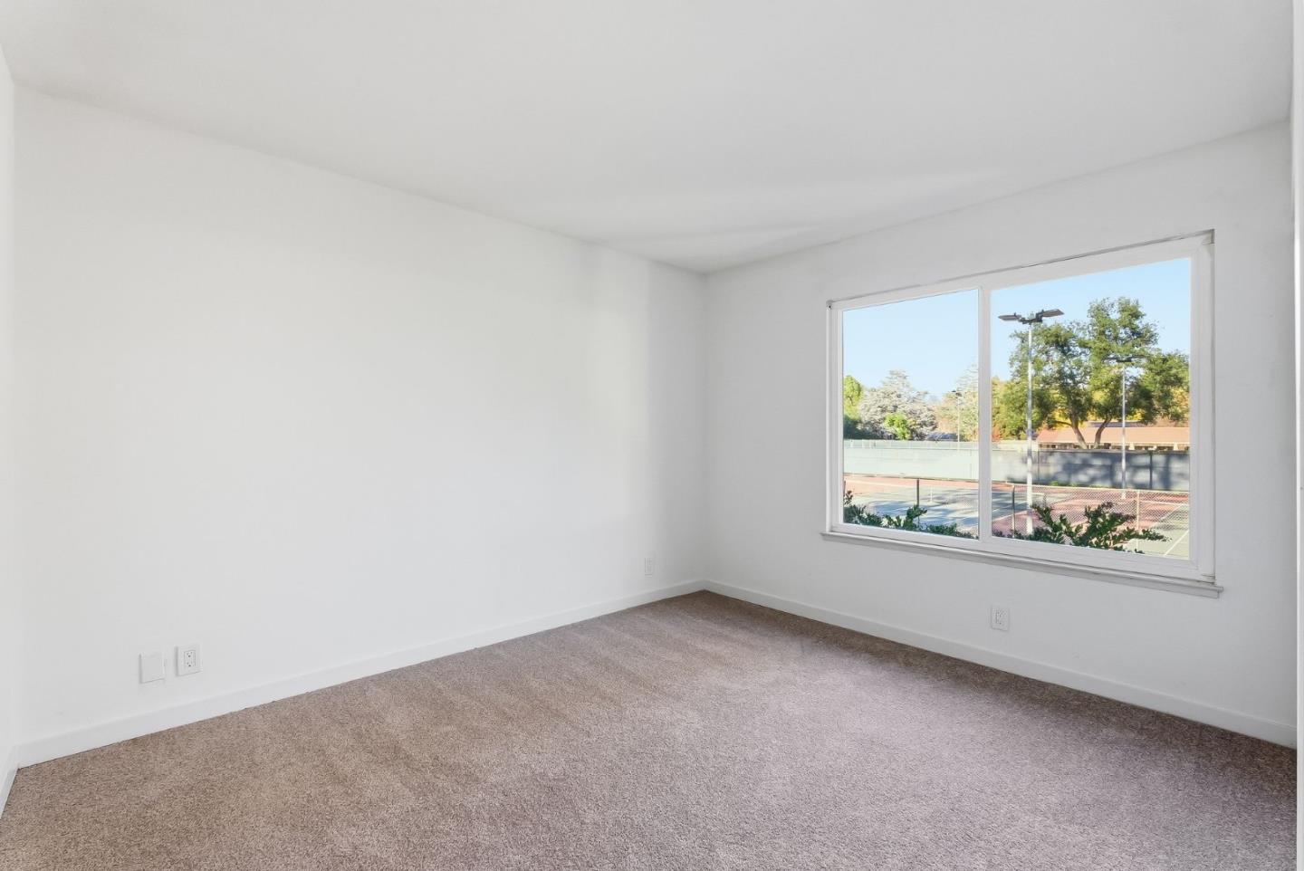 7147 Rouse Court San Jose, CA 95139 - Photo 27 of 36 an empty room with windows