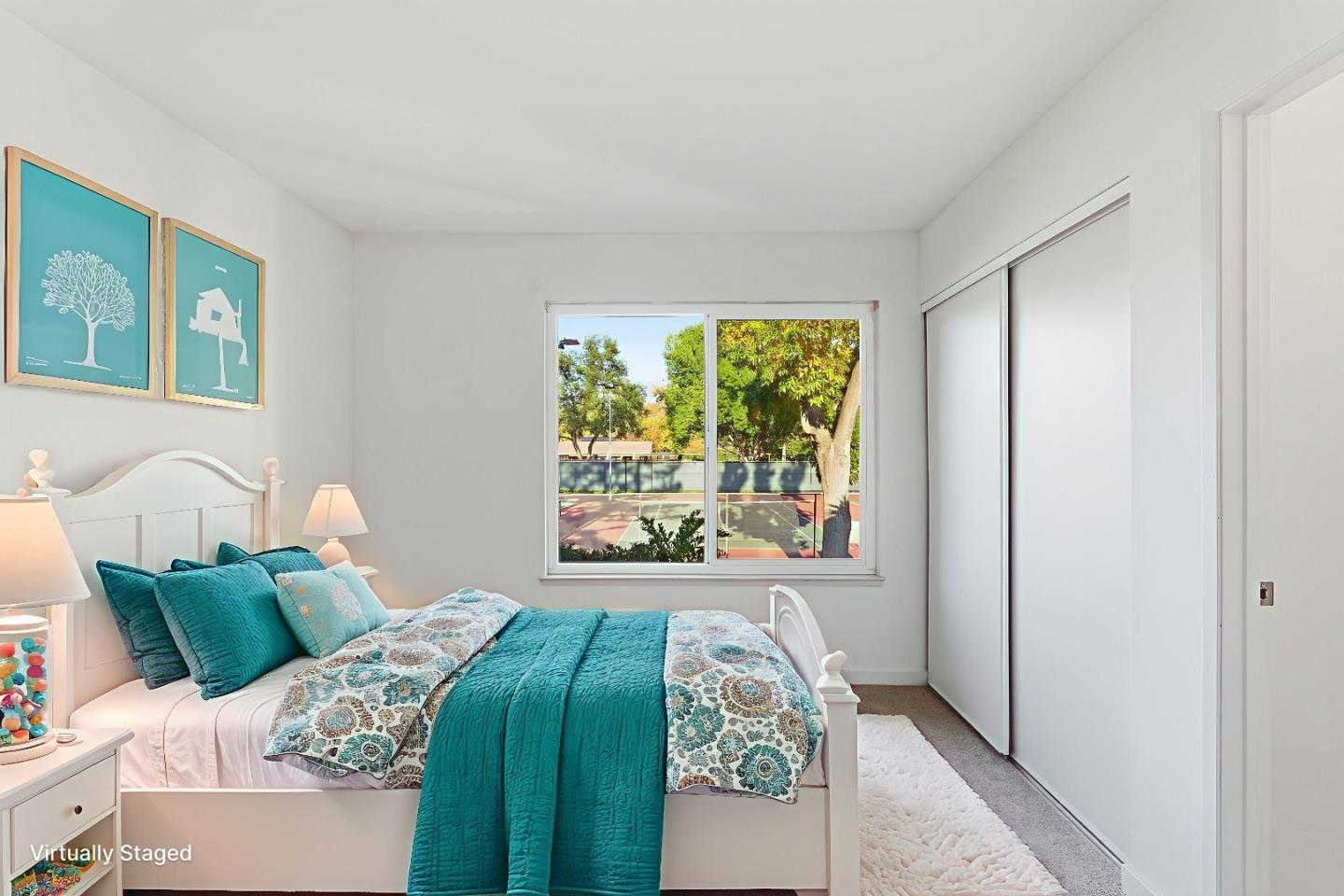 7147 Rouse Court San Jose, CA 95139 - Photo 28 of 36 a bedroom with a bed and a large window