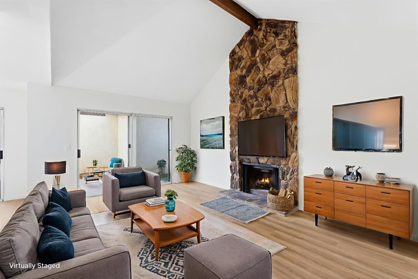 7147 Rouse Court San Jose, CA 95139 - Photo 4 of 36 a living room with furniture and a fireplace