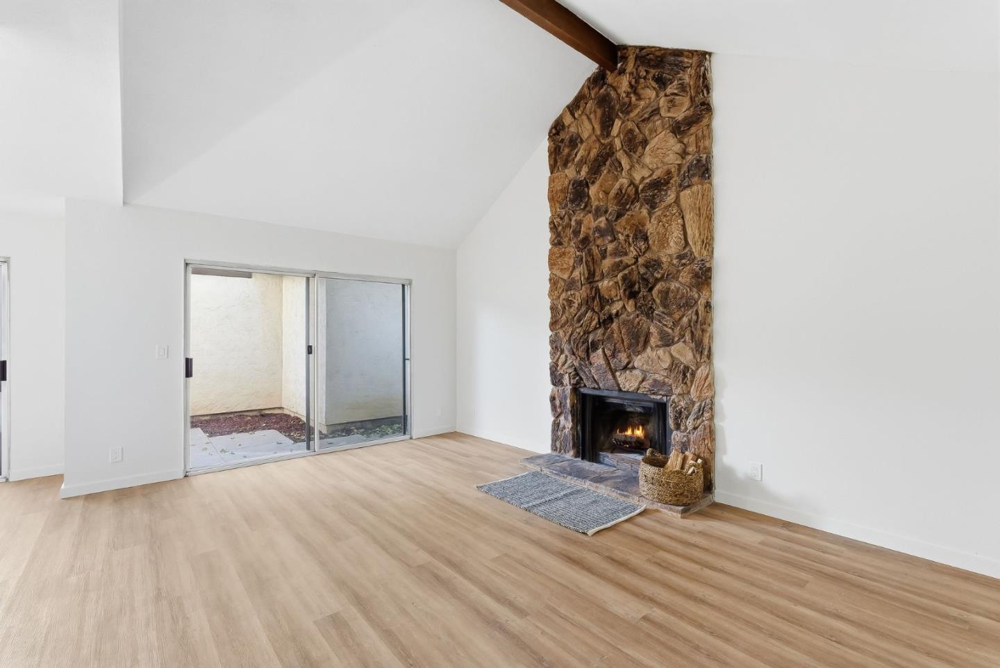 7147 Rouse Court San Jose, CA 95139 - Photo 5 of 36 a view of a livingroom with wooden floor and a fireplace