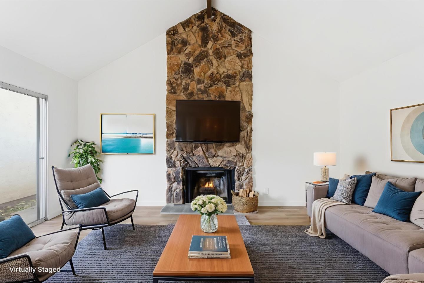 7147 Rouse Court San Jose, CA 95139 - Photo 6 of 36 a living room with furniture a rug and a fireplace