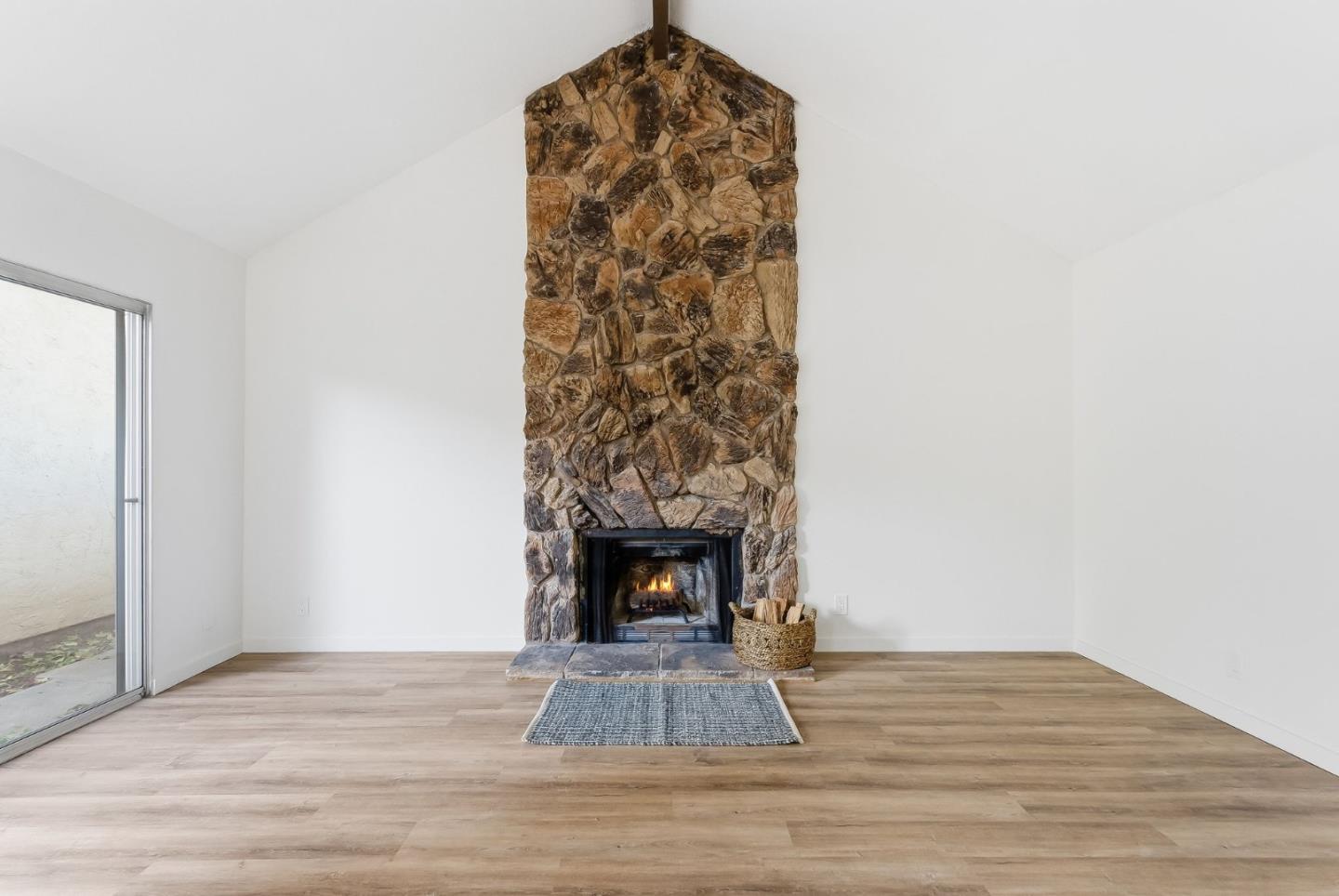 7147 Rouse Court San Jose, CA 95139 - Photo 7 of 36 a living room with a fireplace