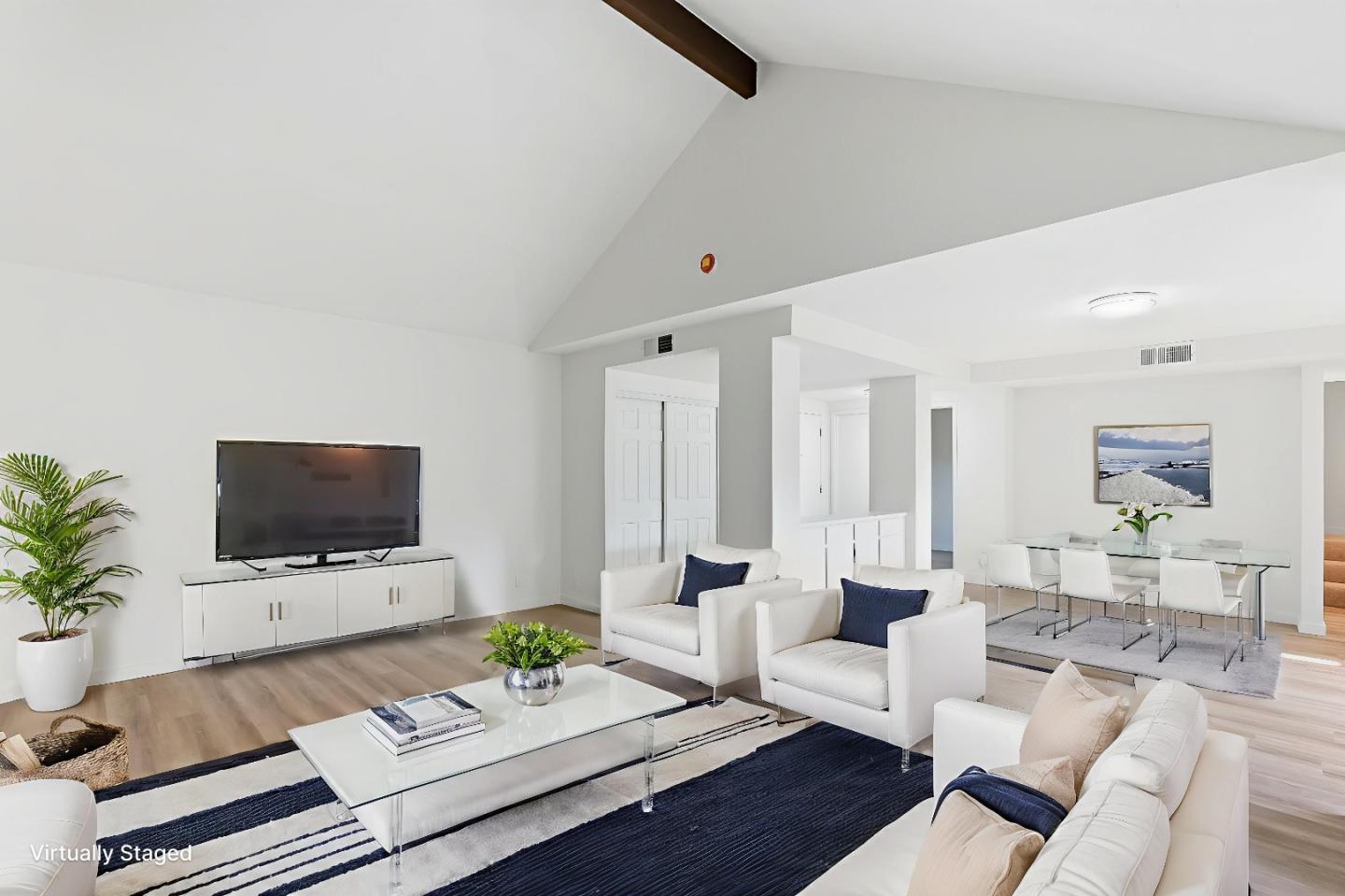 7147 Rouse Court San Jose, CA 95139 - Photo 8 of 36 a living room with furniture a dining table and a flat screen tv