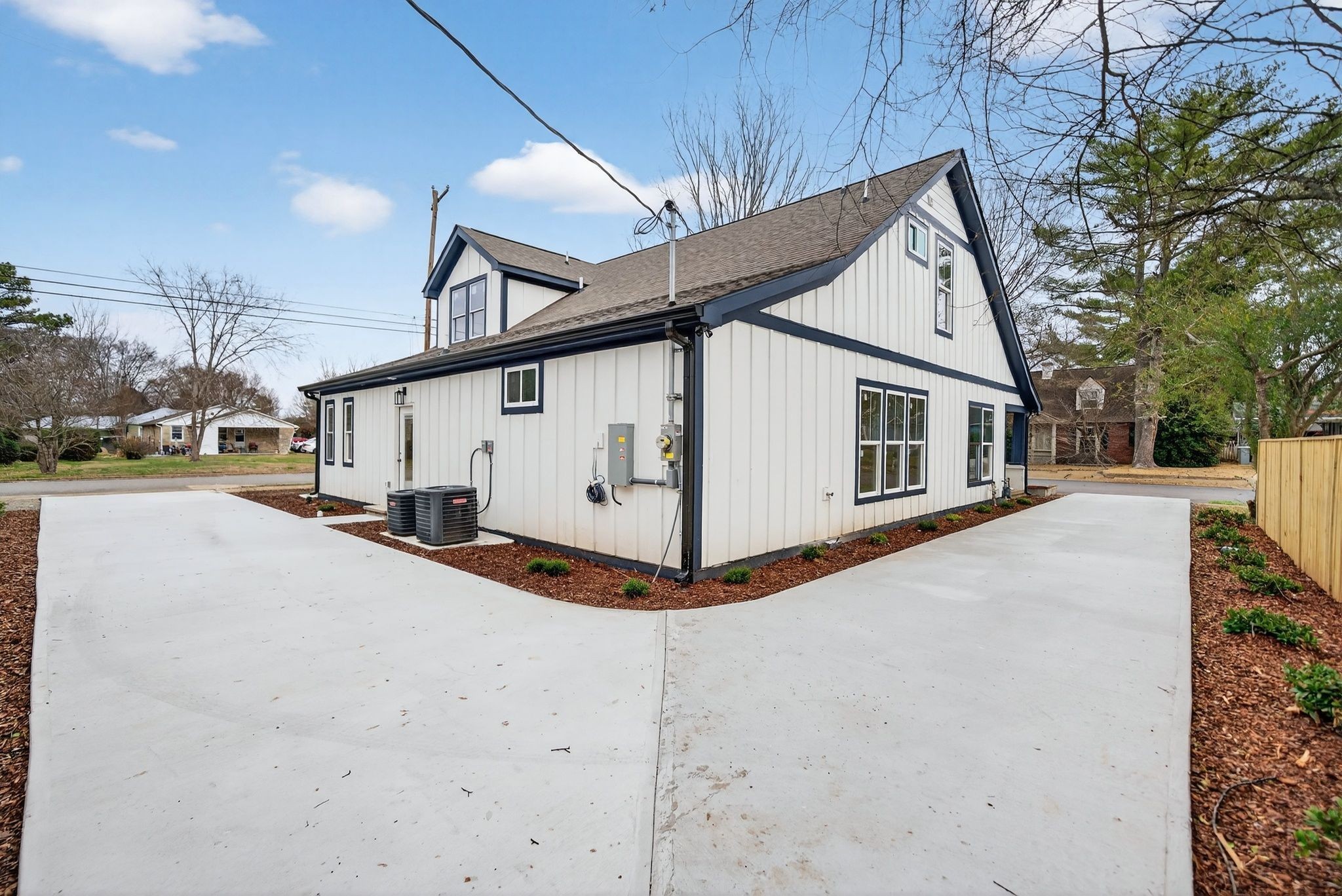 410 3rd Avenue Fayetteville, TN 37334 - Photo 7 of 49 a view of a white house with a big yard