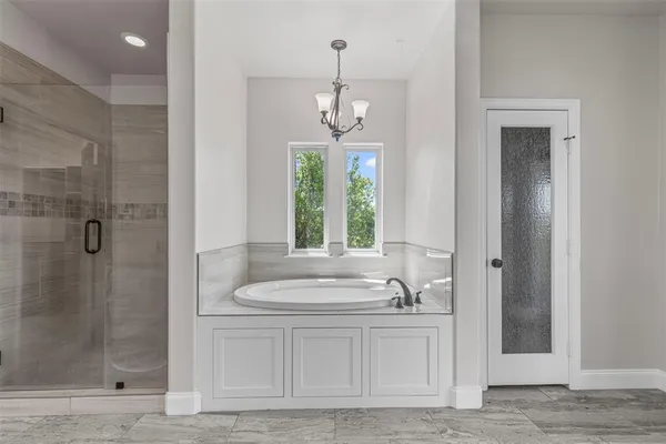 a bathroom with a sink a mirror and a bathtub
