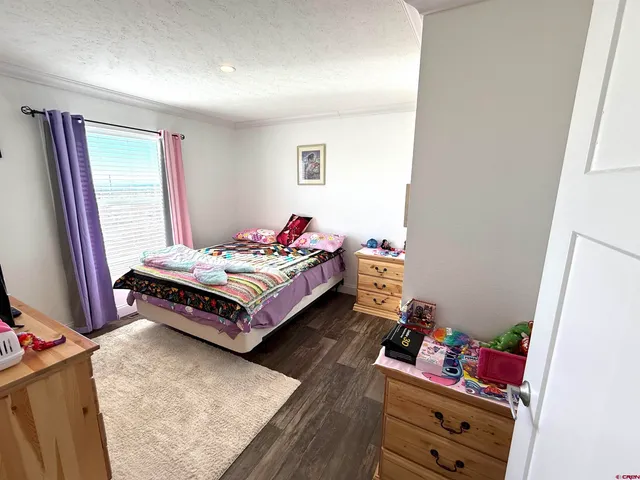 a bed room with a bed and a window