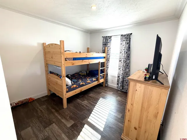 a room with furniture and a flat screen tv