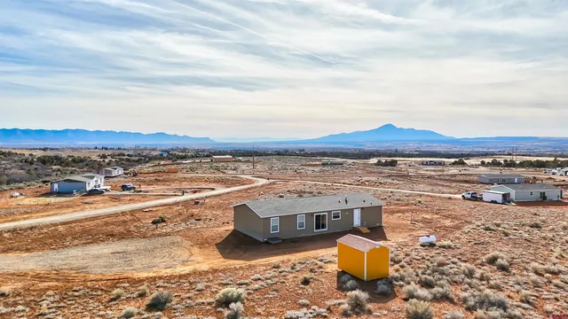 an aerial view of residential building and ocean view