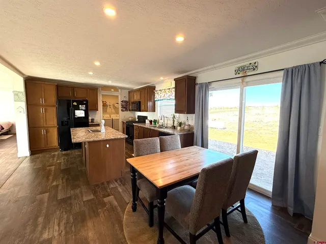 a kitchen with a table and chairs in it