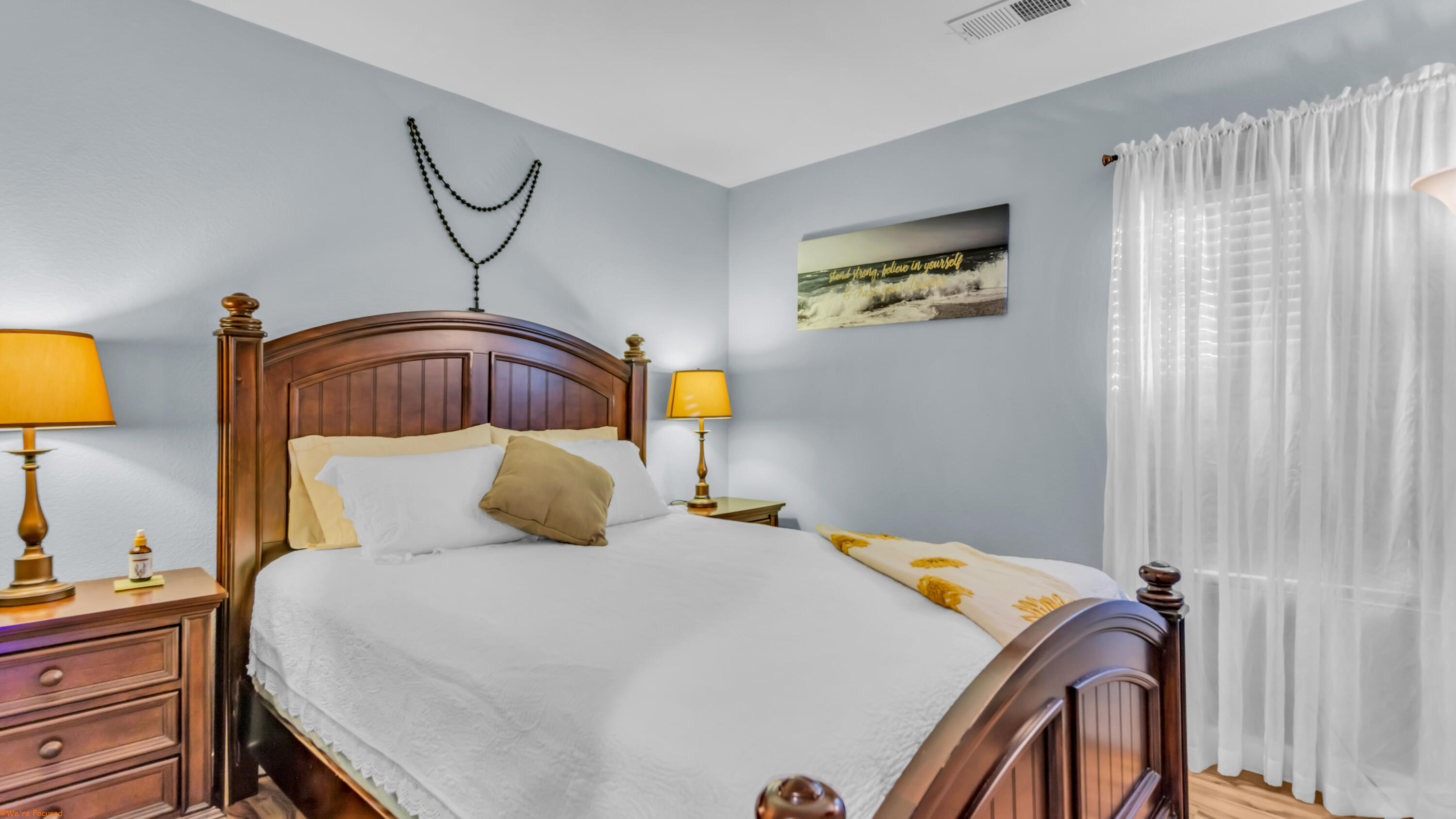 41126 Prospect Court Indio, CA 92203 - Photo 34 of 69 a bedroom with a bed and a chandelier