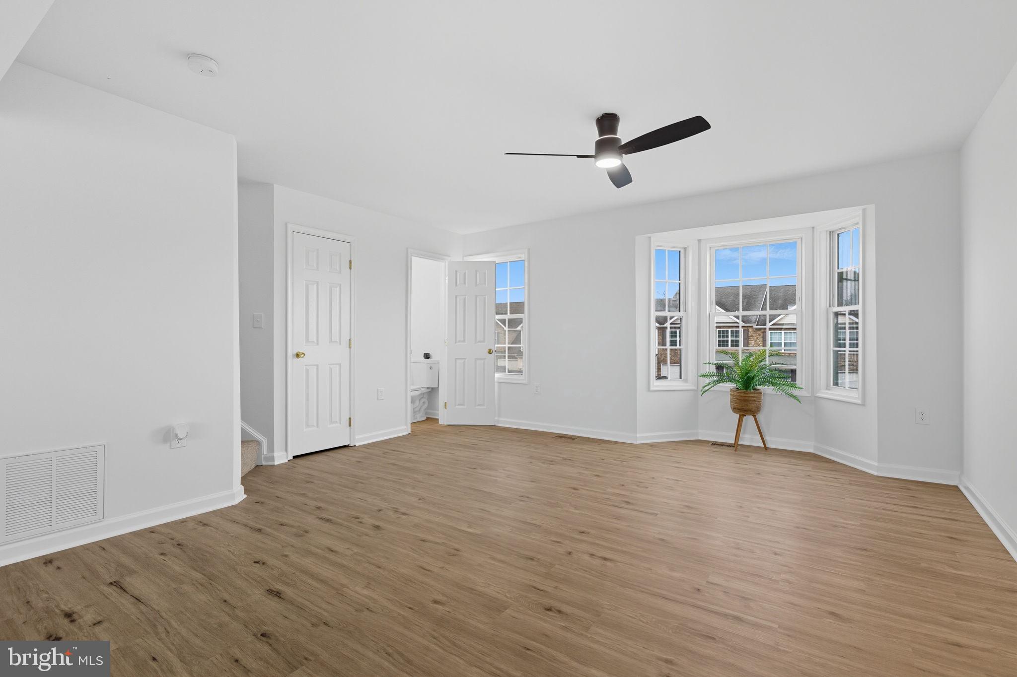 55 Fuzzy Tail Drive Ranson, WV 25438 - Photo 15 of 61 a view of empty room with wooden floor and fan