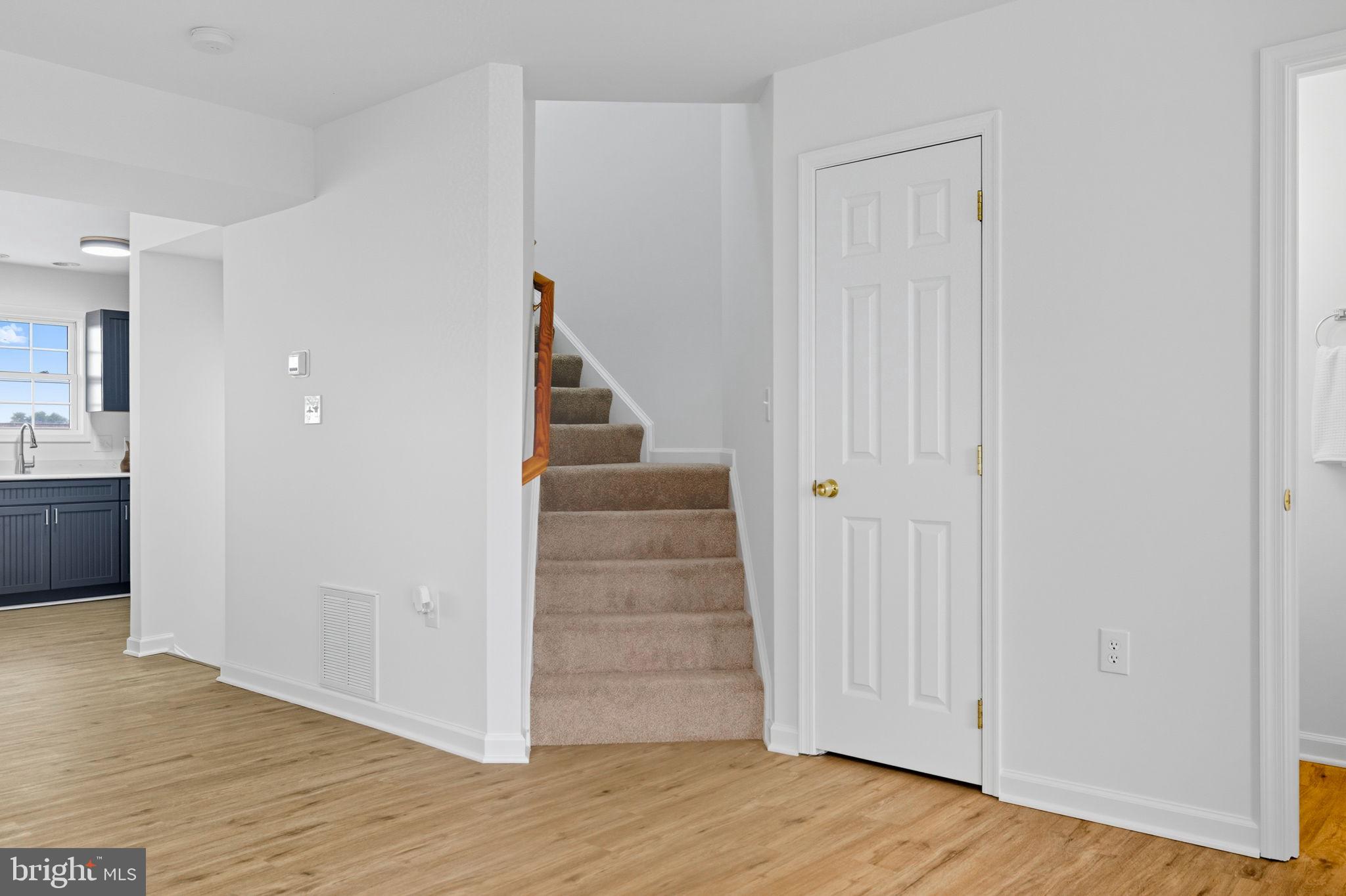 55 Fuzzy Tail Drive Ranson, WV 25438 - Photo 20 of 61 a view of entryway and hall with wooden floor