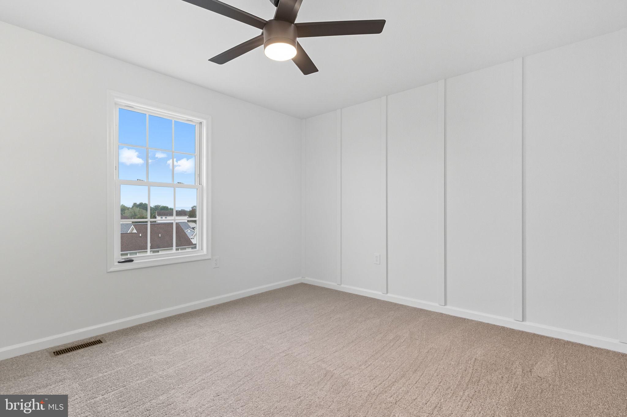 55 Fuzzy Tail Drive Ranson, WV 25438 - Photo 21 of 61 an empty room with a window and a fan