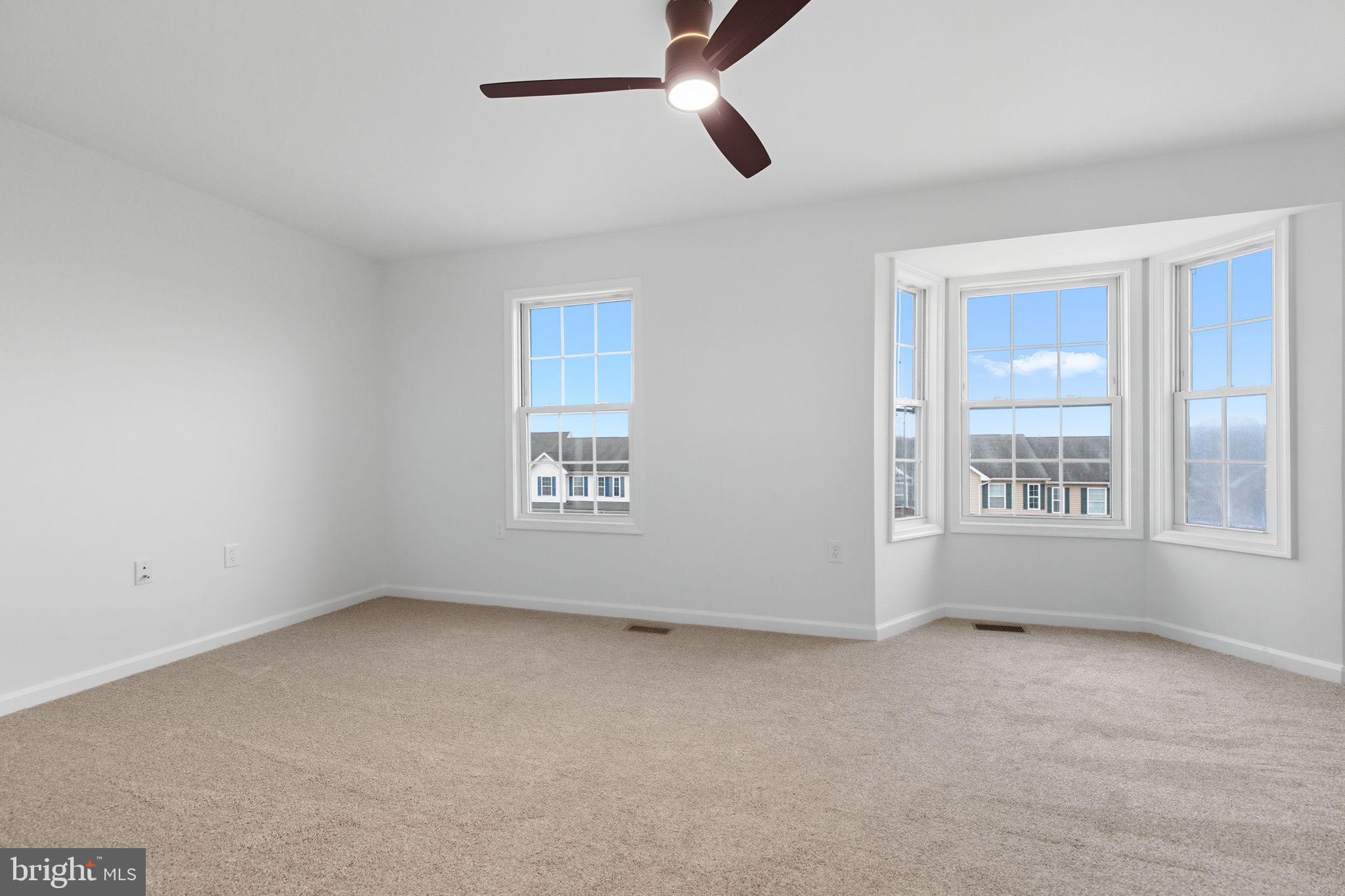 55 Fuzzy Tail Drive Ranson, WV 25438 - Photo 28 of 61 a view of an empty room with a window