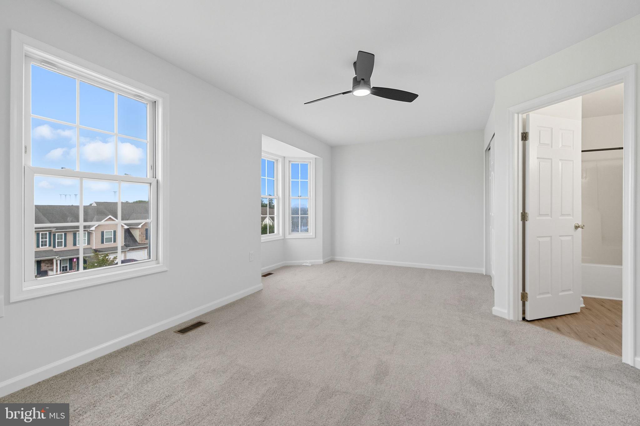 55 Fuzzy Tail Drive Ranson, WV 25438 - Photo 29 of 61 wooden floor in an empty room with a window