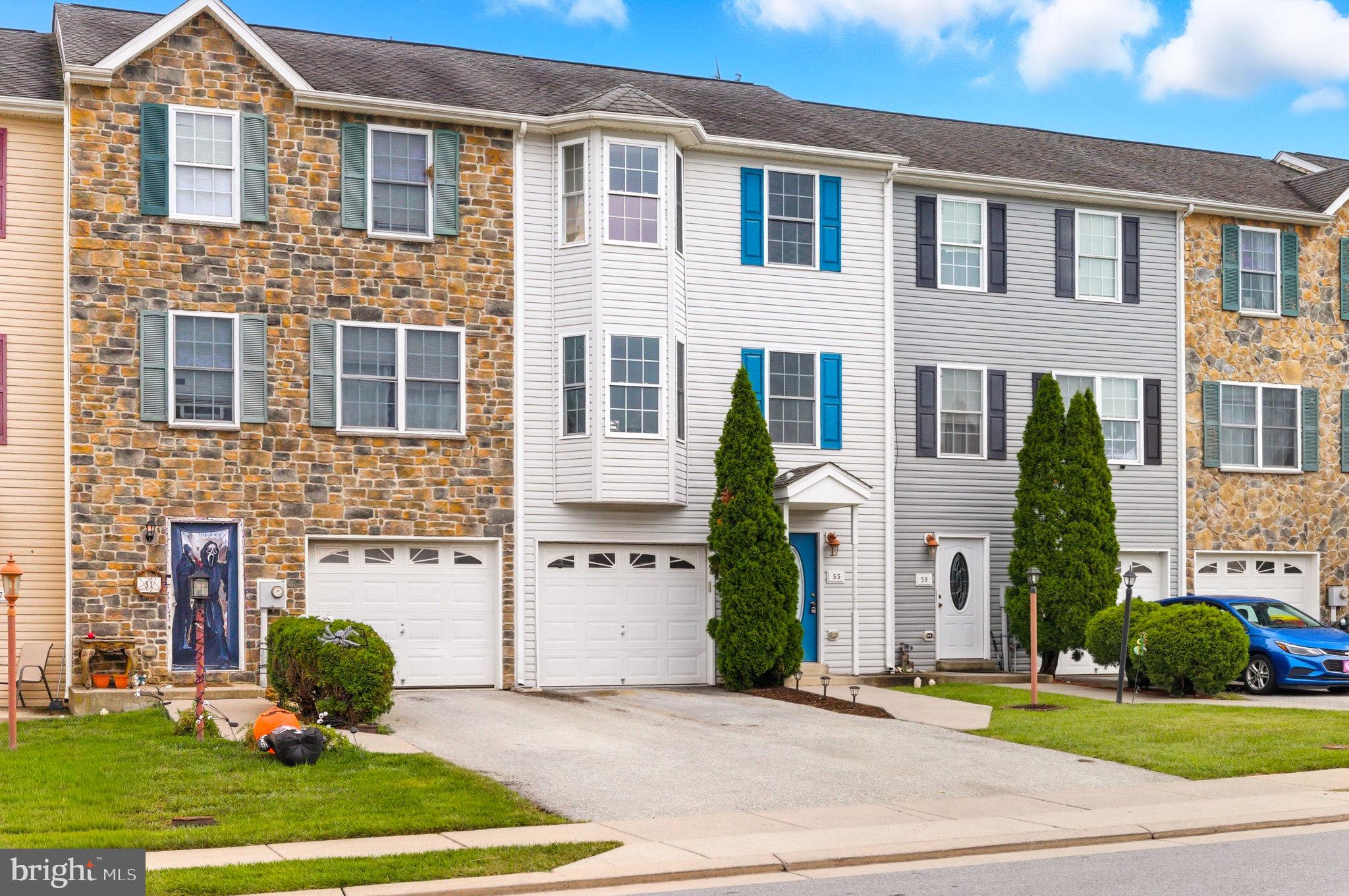 55 Fuzzy Tail Drive Ranson, WV 25438 - Photo 3 of 61 a front view of a house with garden