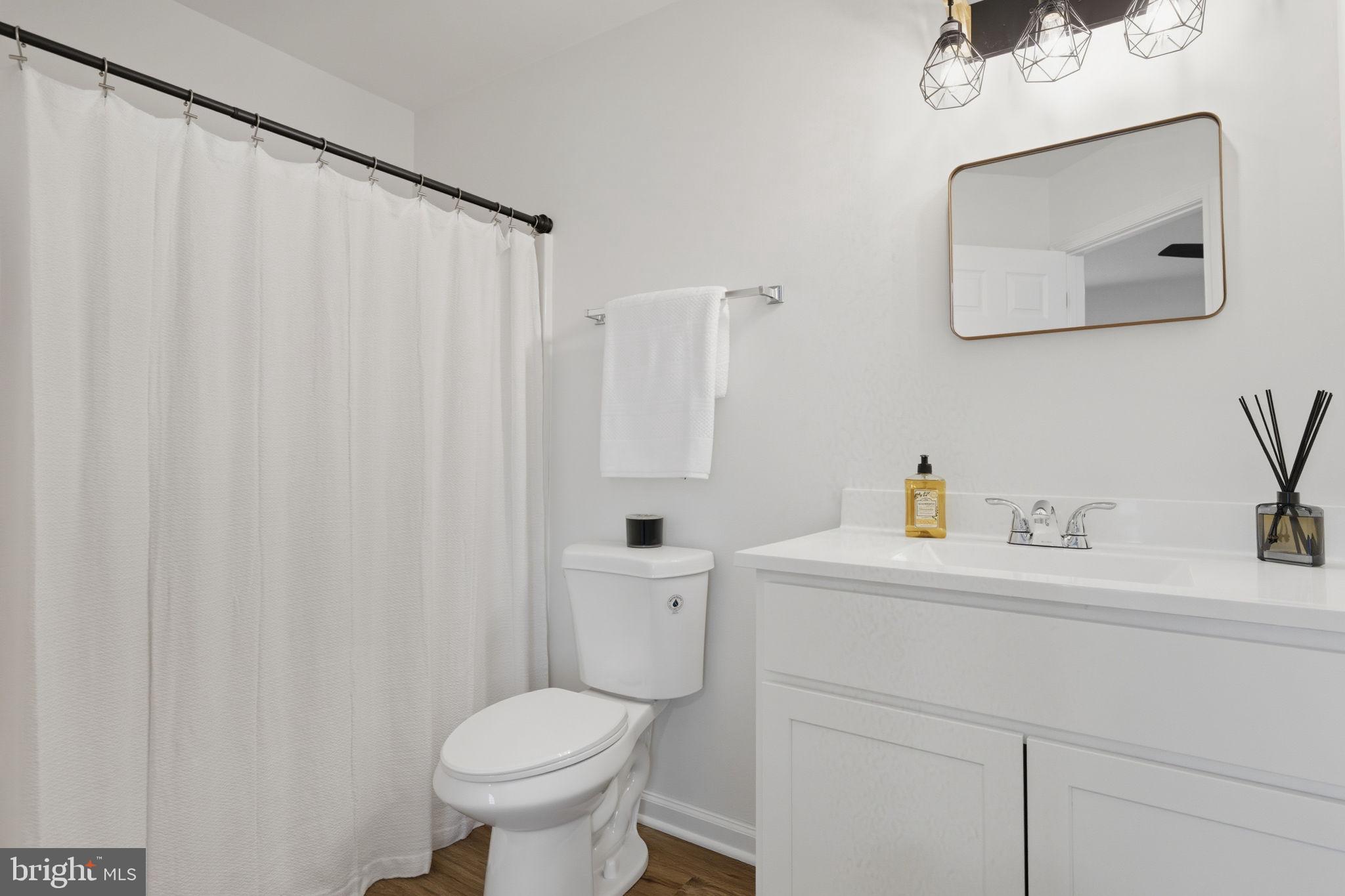 55 Fuzzy Tail Drive Ranson, WV 25438 - Photo 31 of 61 a bathroom with a toilet sink and mirror