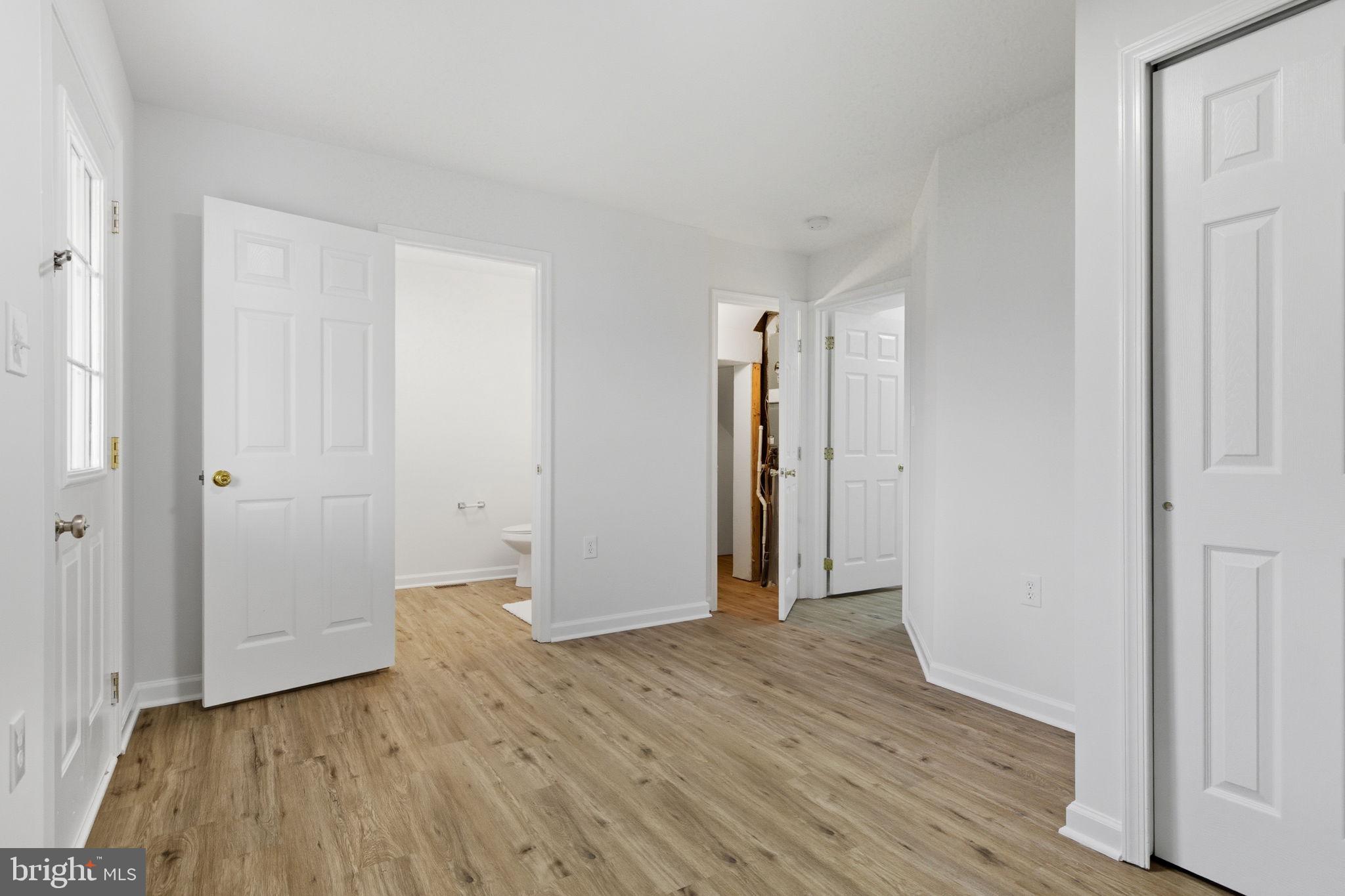 55 Fuzzy Tail Drive Ranson, WV 25438 - Photo 38 of 61 a view of an empty room with wooden floor and closet