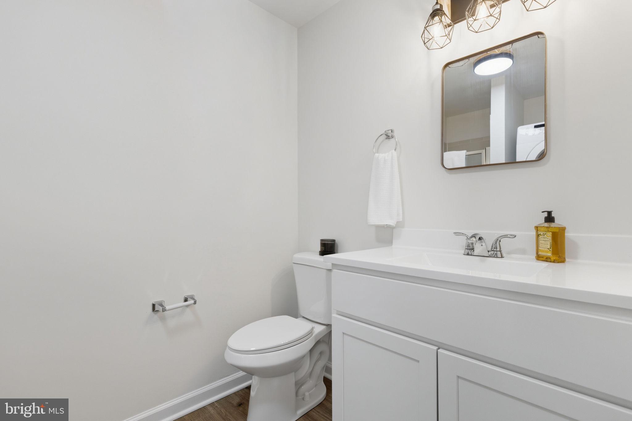 55 Fuzzy Tail Drive Ranson, WV 25438 - Photo 39 of 61 a bathroom with a toilet sink and mirror