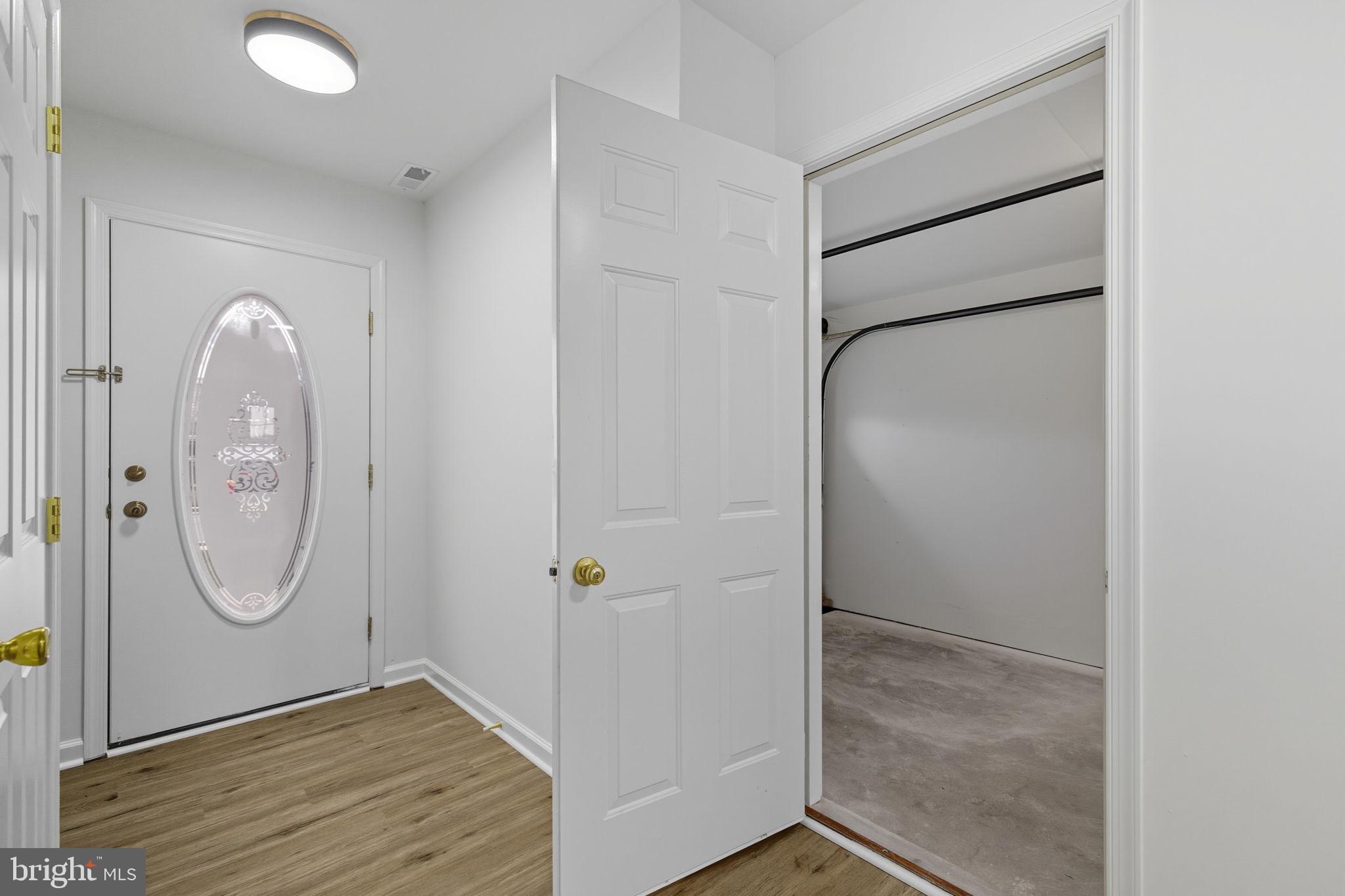 55 Fuzzy Tail Drive Ranson, WV 25438 - Photo 43 of 61 an empty room with wooden floor mirror and window