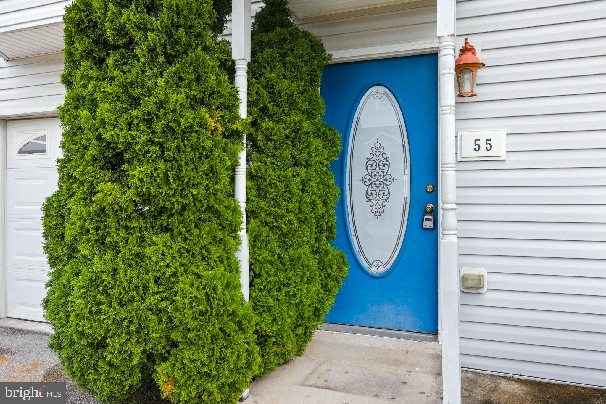55 Fuzzy Tail Drive Ranson, WV 25438 - Photo 48 of 61 a front view of a house with garden