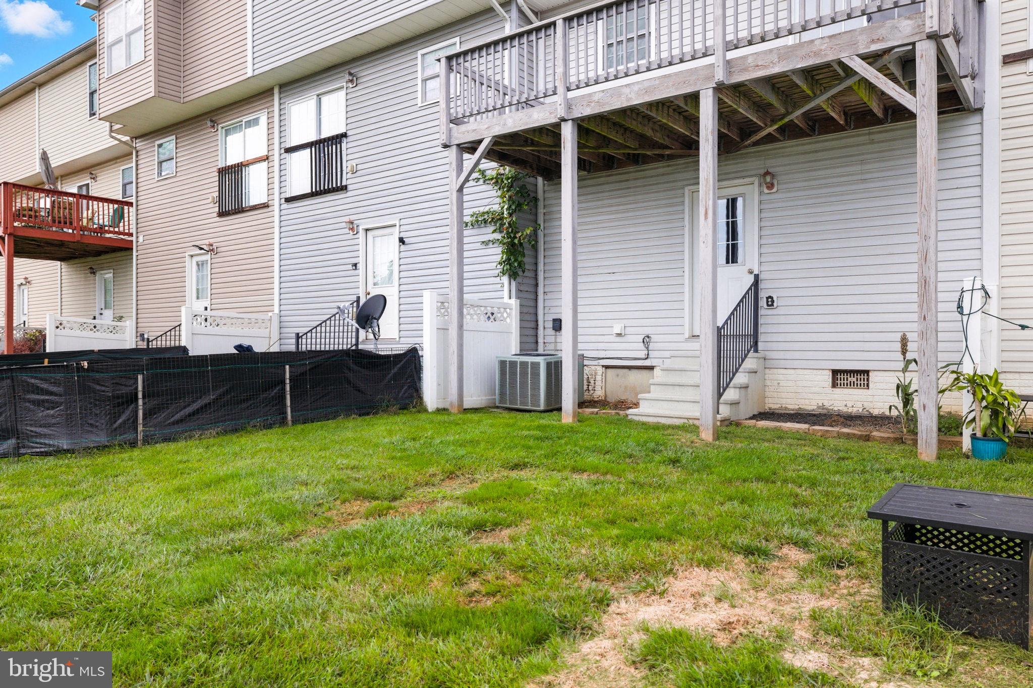 55 Fuzzy Tail Drive Ranson, WV 25438 - Photo 50 of 61 a view of backyard with table and chairs and potted plants