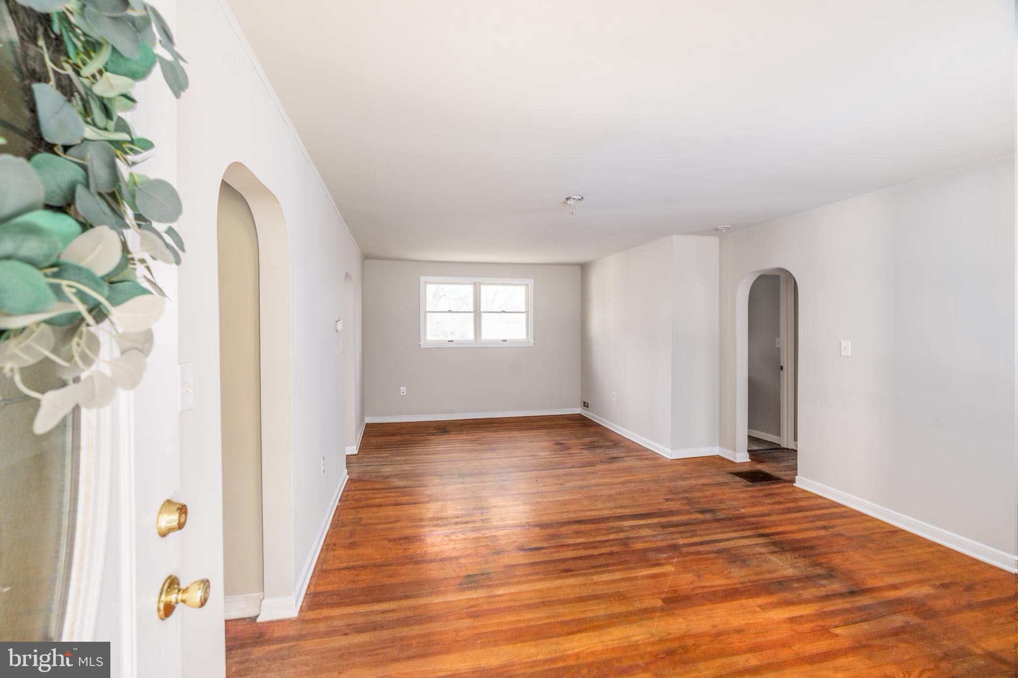 264 Union Church Road Elkton, MD 21921 - Photo 2 of 12 a view of a room with wooden floor and a potted plant