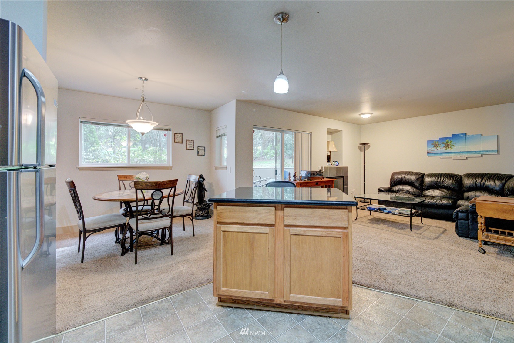 5809 Hwy Place, Unit B103 Everett, WA 98203 - Photo 14 of 30 a living room with furniture a window and chairs