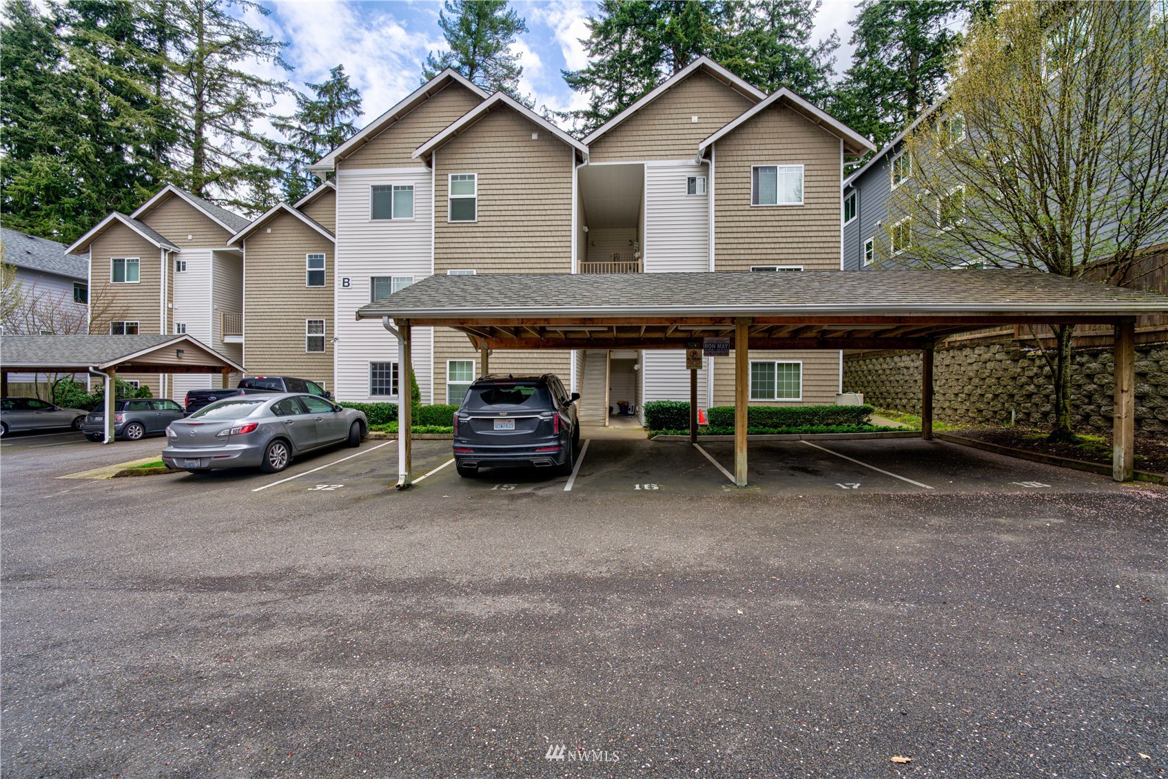 5809 Hwy Place, Unit B103 Everett, WA 98203 - Photo 2 of 30 a view of a house with a cars park side of a road