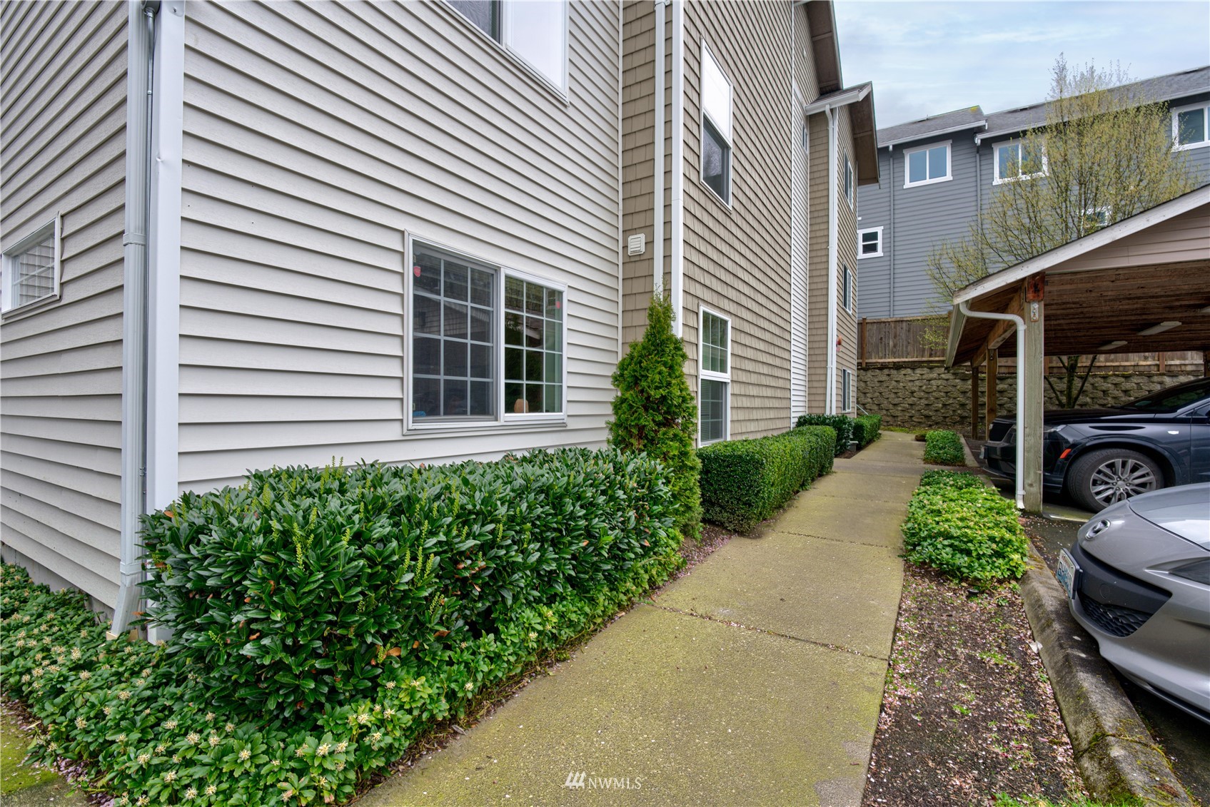 5809 Hwy Place, Unit B103 Everett, WA 98203 - Photo 3 of 30 a view of a backyard with plants