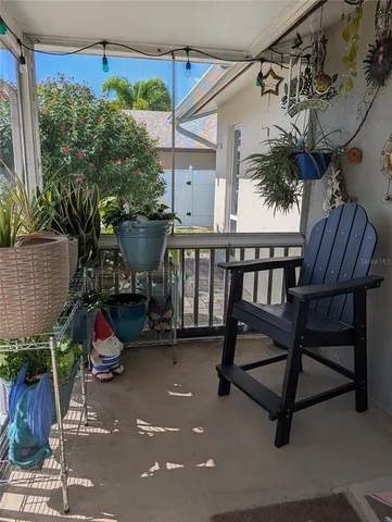 a view of a chair and tables in the garden