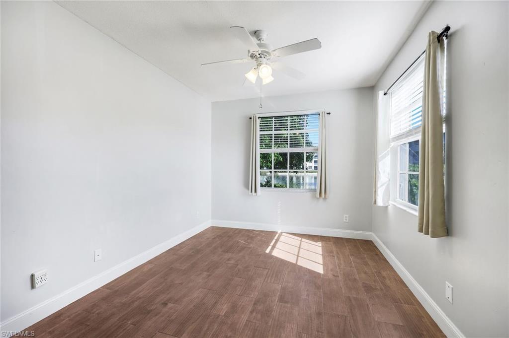 4620 St Croix Lane, Unit 911 Naples, FL 34109 - Photo 10 of 26 Primary Bedroom with lakeview