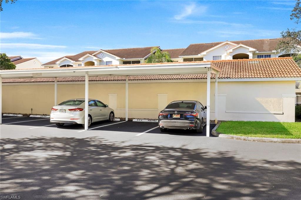 4620 St Croix Lane, Unit 911 Naples, FL 34109 - Photo 24 of 26 Reserved covered carport for your car.