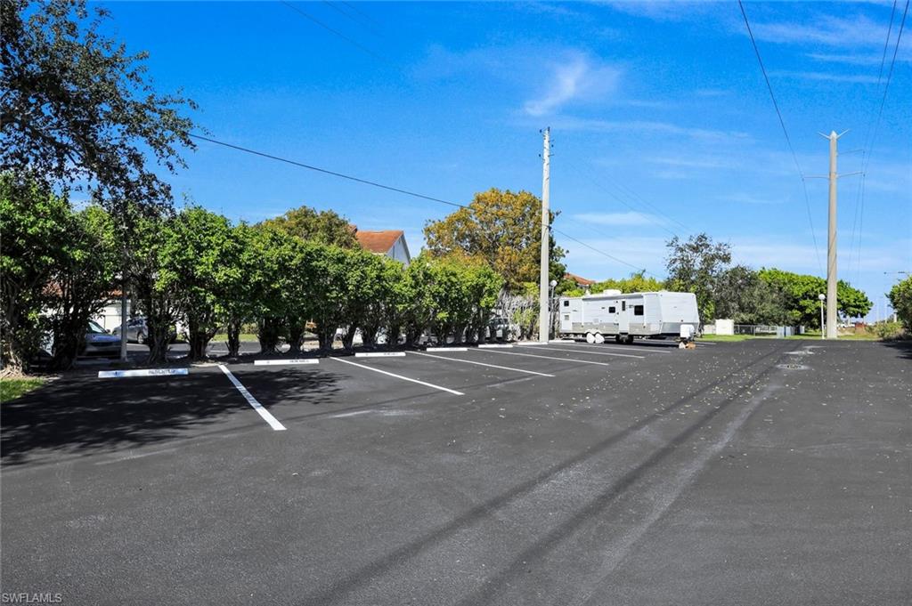 4620 St Croix Lane, Unit 911 Naples, FL 34109 - Photo 25 of 26 RV and boat parking lot is part of the community.