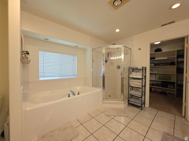 387 North Loafer Canyon Road Payson, UT 84651 - Photo 38 of 94 Spacious bathroom featuring a built-in soaking tub, separate glass-enclosed shower, ceramic tile flooring, and recessed lighting